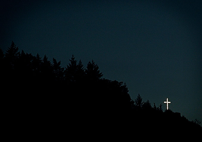 In pictures: Religion: A lit cross on a hill in the Mosel Valley