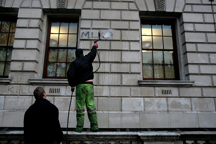 Student Protest Aftermath: cleaning grafitti of the walls of the Treasury