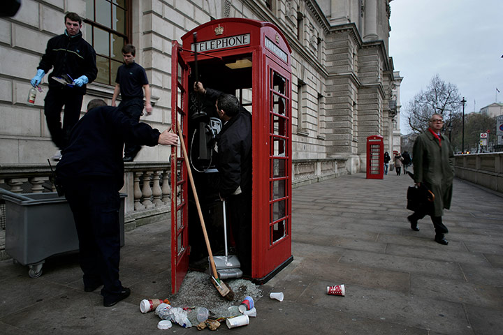Student Protest Aftermath: Cleaning a telephone booth after
