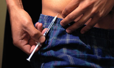 Diabetes: A man injects himself with insulin