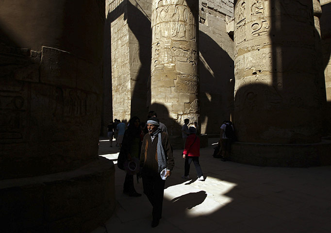 24 Hours in Pictures: A man walks in Karnak Temple in Luxor