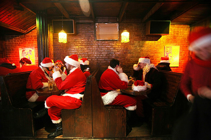 24 Hours in Pictures: Revelers dressed as Santa Claus at the annual Santacon event in New York