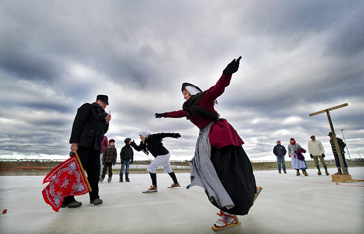 24 hours: Biddinghuizen, The Netherlands: People skate on the Flevonice ice track