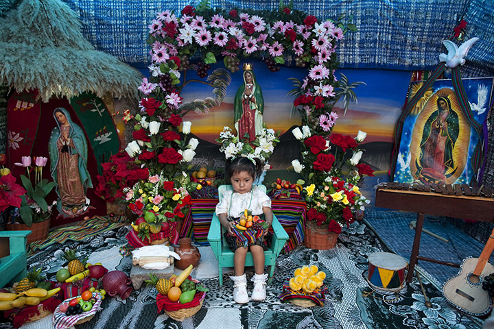 24 hours: Guatemala City, Guatemala: A girl sits while having her photo taken