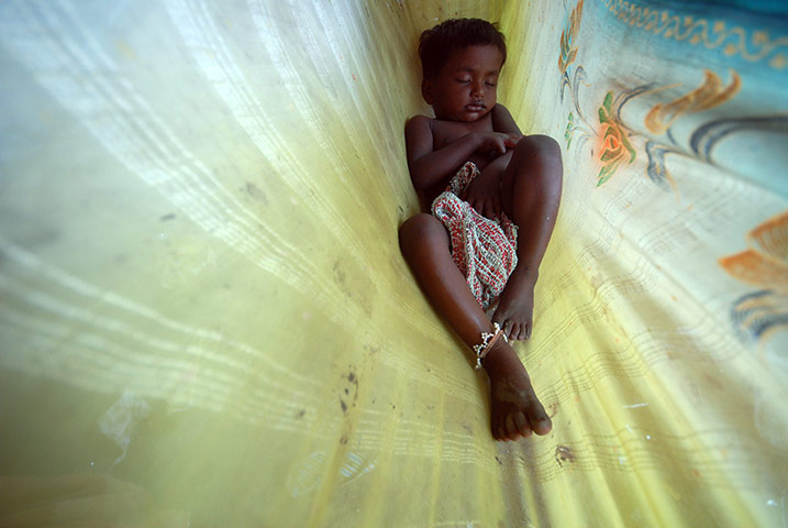 24 hours: Mumbai, India: Sakku Pawar, 3, sleeps at the Bholanagar slums