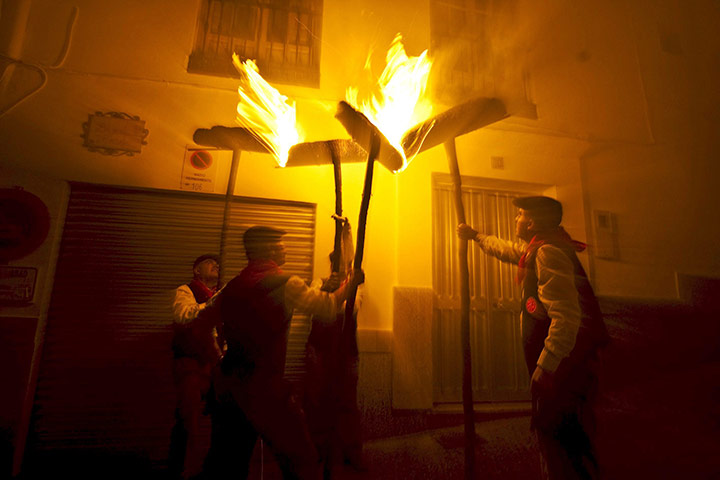 24 hours: Casarabonela, Spain: A group of men hold burning 'rondeles' 