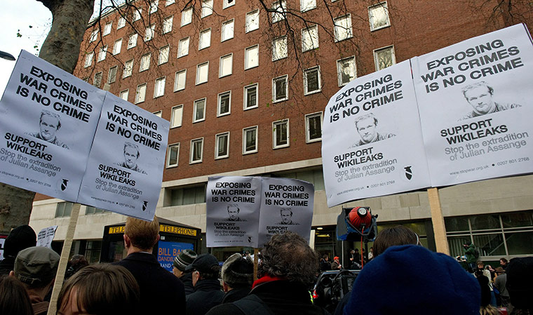 Julian Assange Trial: Protestors hold placards as they demonst