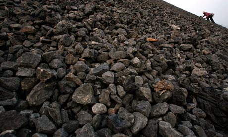 Labourer sorts rocks