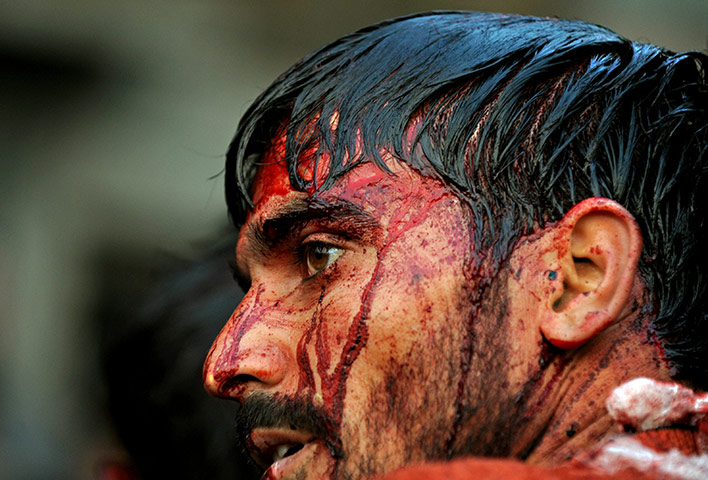 24 hours in pictures: An Indian Kashmiri Shiite Muslim bleeds after flagelating himself