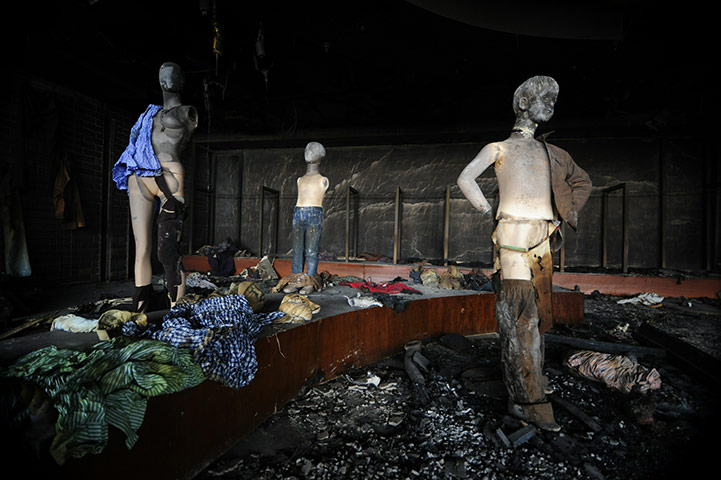 24 hours in pictures: Burnt mannequins are seen at a showroom, Bangladesh