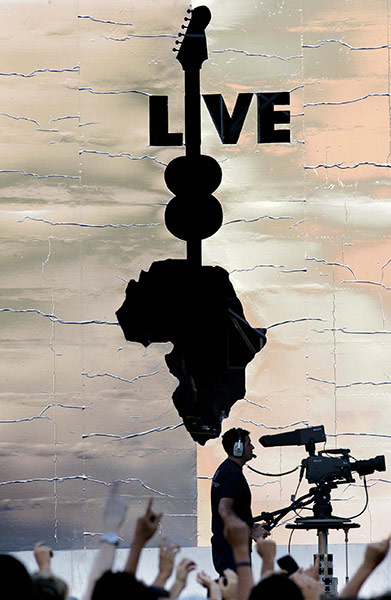 MDG:  Celebrities 2: A TV cameraman films singers at Rome's f