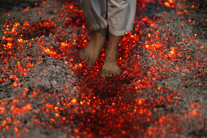 Ashura Religious Festival: A Shi'ite Muslim walks on fire at a ceremony during the Ashura festival