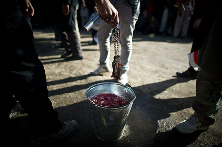 Ashura Religious Festival: An Afghan Shiite Muslim man cleans his blades during Ashura Kabul
