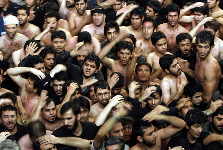 Ashura Religious Festival: Iranians and Iraqi Shiite mourn at the Ashura ceremonies