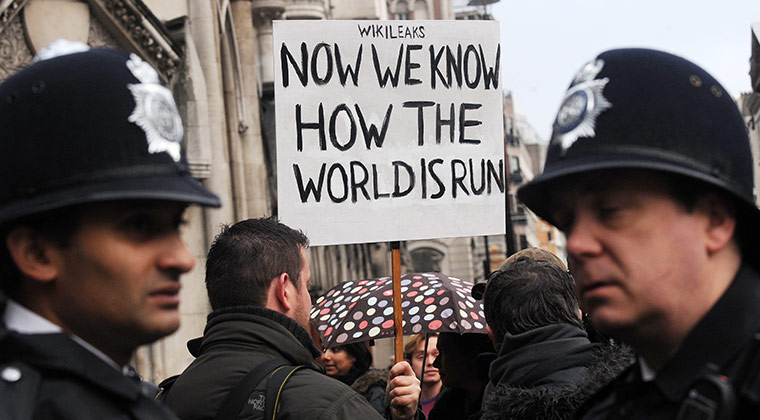Julian Assange Trial: A 'Free Julian Assange' protester demonstrates outside the High Court