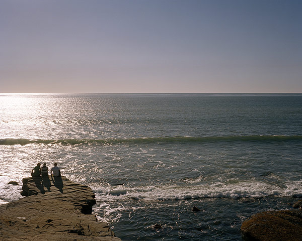 California Classics: Three people looking out to the Pacific Ocean from San Diego