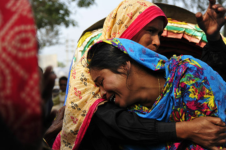 24 hours in pictures: A woman cries at the Hamim Group garment factory