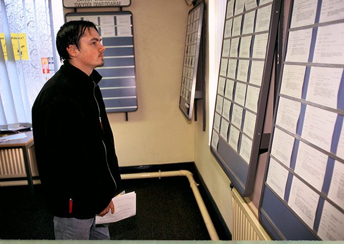 Business Week in Pictures: Man in job centre looking for vacancies South Wales