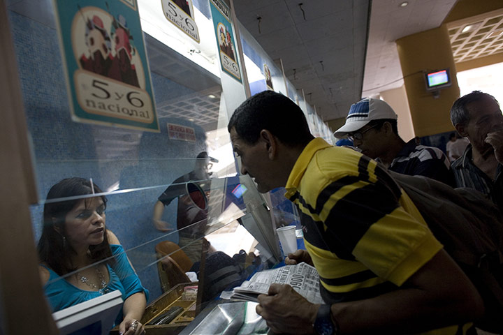 Fromtheagencies Cubillos: A man makes his bets during the Caribbean Classic Series in Caracas