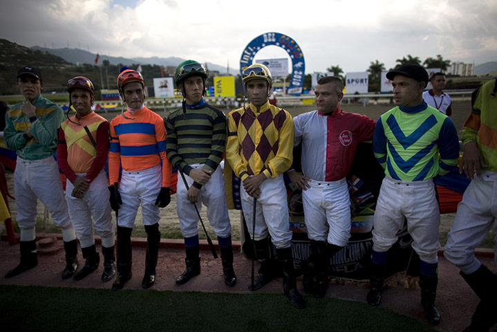 Fromtheagencies Cubillos: Jockeys stand before horse racing in Caracas Venezuela