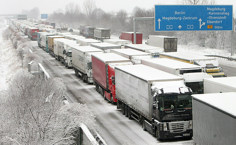 Winter Weather Europe: Trucks are stuck on a snowy motorway near Ebendorf, northern Germany