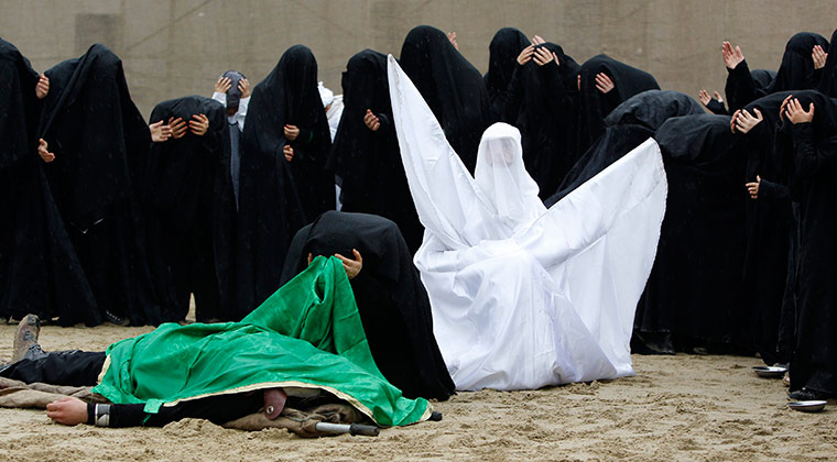 24 hours in pictures: Shia women take part in a re-enactment of the battle of Kerbala