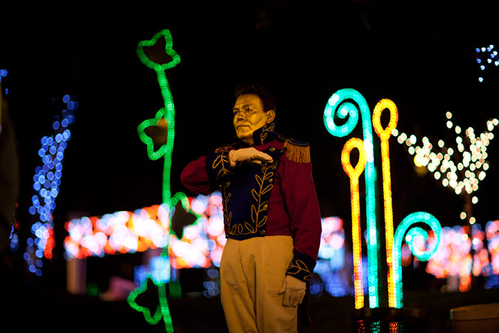 24 hours in pictures: A mime performs near Christmas decorations in Columbia