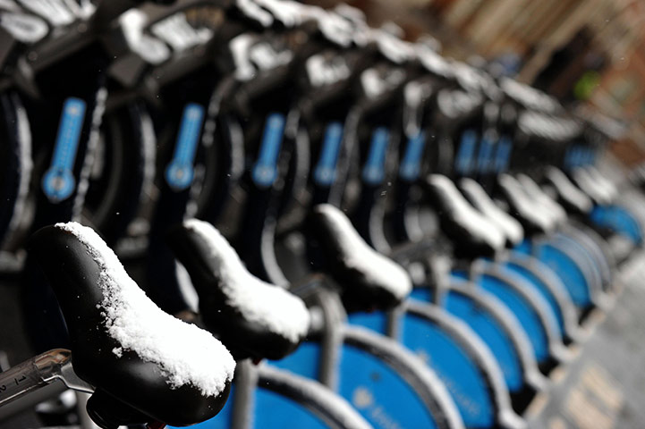 Winter Weather in the UK: Snow falls on a bike bay in central London