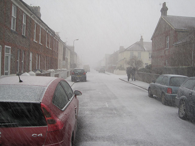 Winter Weather in the UK: A light dusting of snow settles on a street in Eastbourne, East Sussex
