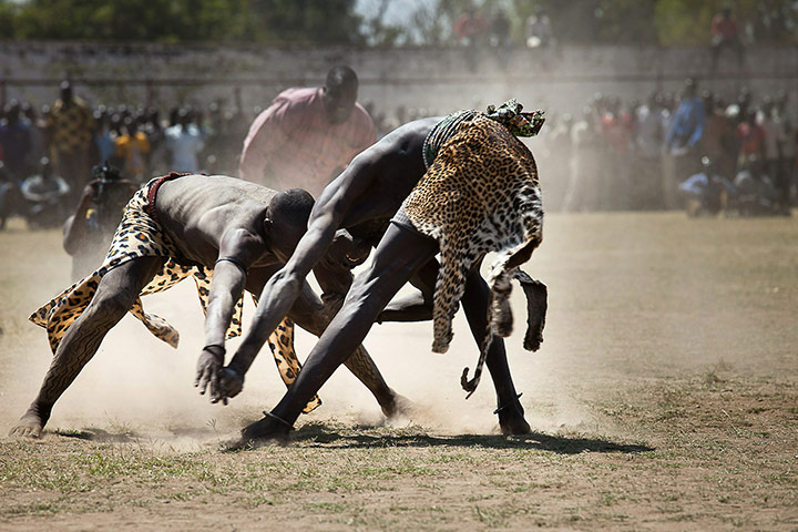 24 hours: Juba, Sudan: Two Sudanese wrestlers fight at a stadium 