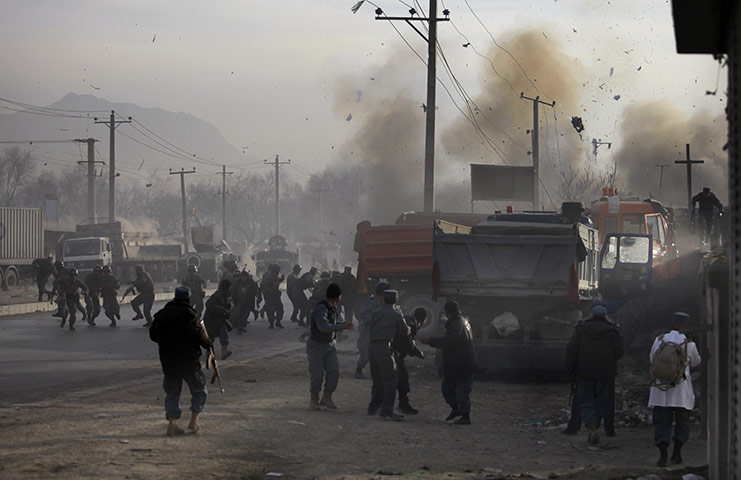 24 hours: Kabul, Afghanistan: Afghan soldiers run for cover as a bomb explodes