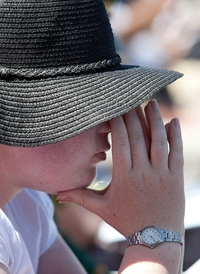 A girl praying during New Zealand miner memorial service