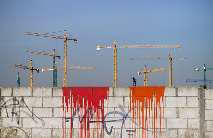 Week in business: Cranes are seen on an unfinished construction site, Madrid, Spain.