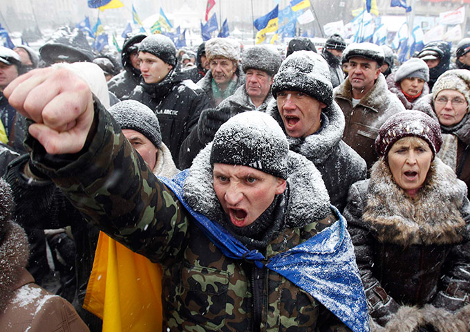 24 hours in pictures: Demonstrators hold a rally to protest in central Kiev