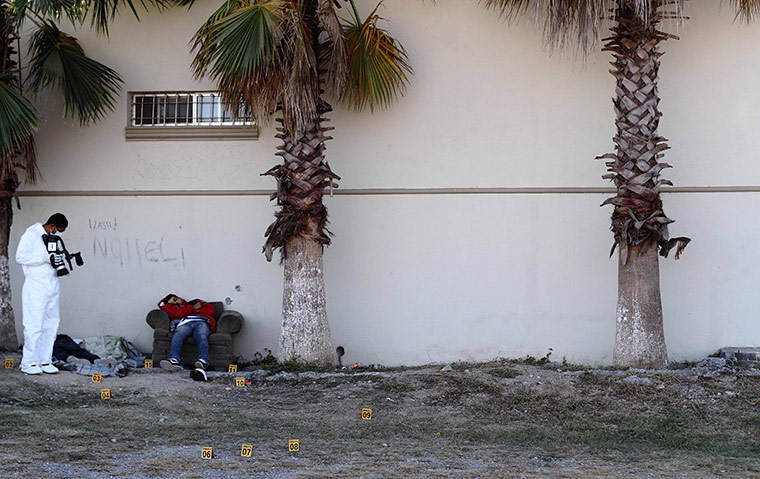 24 hours in pictures: A forensic investigator films a crime scene, Mexico