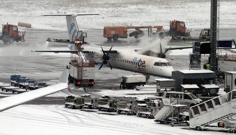 Week in business: A plane from the British airline Flybe is de-iced in Frankfurt am Main