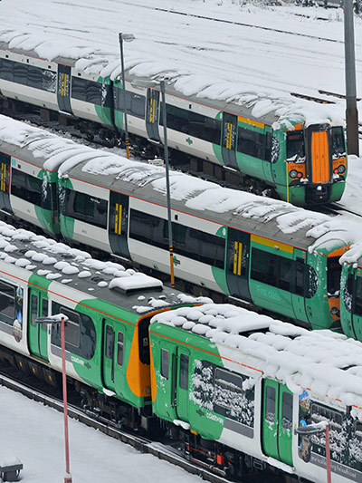 Winter weather: Trains stand at Brighton station as services are severely delayed