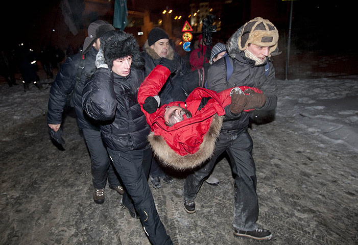 Belarus election violence: Supporters carry presidential candidate Vladimir Neklyayev