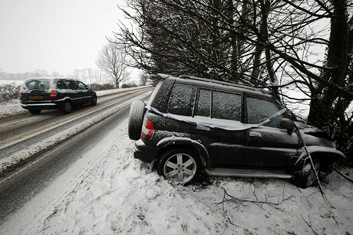 snow continues in uk: A car is left abandoned