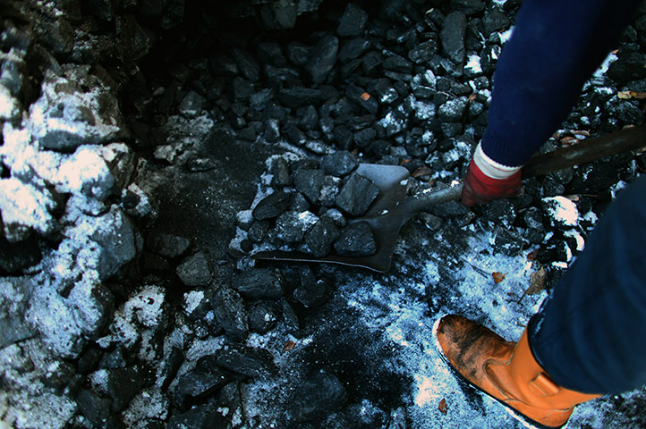snow continues in uk: coal men in scotland