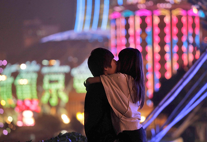 24 hours in pictures: A couple kiss in front of Casino Lisboa in Macau