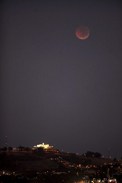 Lunar Eclipse: A total lunar eclipse is seen as the full moon is shadowed by the Earth