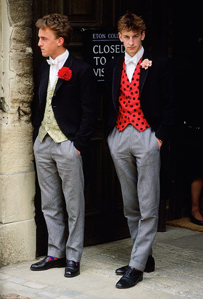 School Uniforms: Two schoolboys from Eton stand in flamboyant school uniform