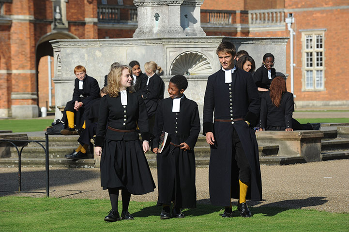 School Uniforms: Students outside a tudor building wearing traditional tudor uniform