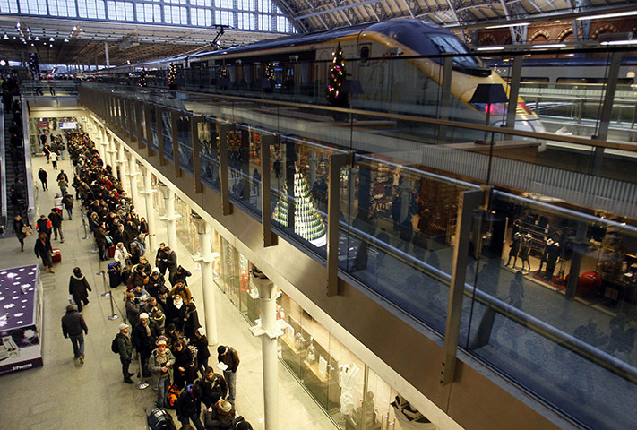 Travel Chaos: Passengers queue for Eurostar trains as a train leaves at St Pancras