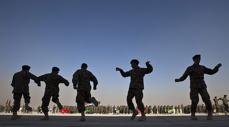 24 hours: Kabul, Afghanistan: Officers from the Afghan National Army NCOs dance