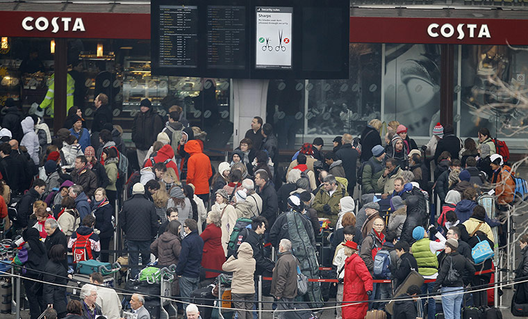 Travel Chaos: Passengers queue outside Terminal 3, to have their boarding passes checked