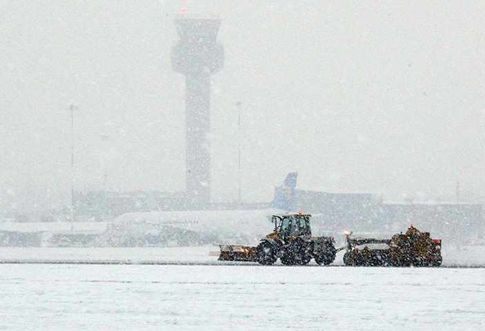 Travel Chaos: A plough clears the runway of snow at East Midlands Airport
