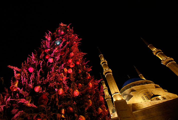 Christian in Middle East: A Christmas tree is seen in front of the Al-Amin mosque in downtown Beirut