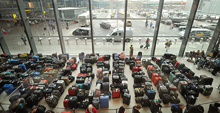 Week in Business: Rows of passenger luggage items stacked in Heathrow airport's Terminal 3.